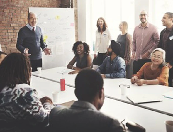 Sales growth coach in Chicago, IL, leading a training workshop to help a team increase revenue and customer base.