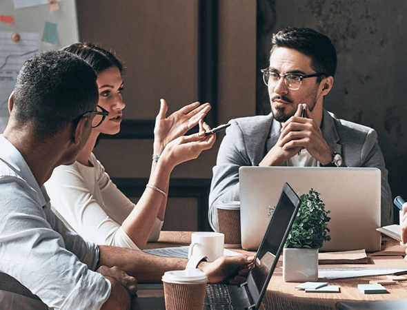 A group of professionals collaborating in a meeting for strategic goal planning and structured goal mapping in Minneapolis.